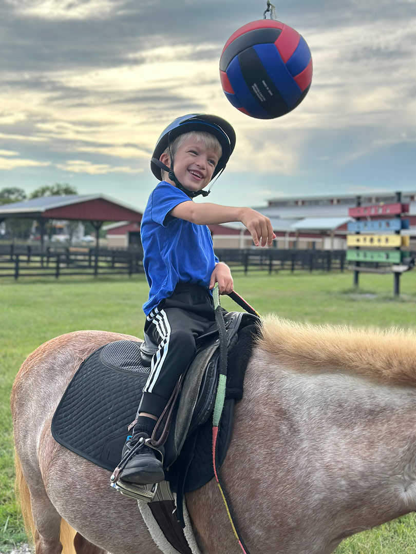 A participant at Saddle Up equine assisted services